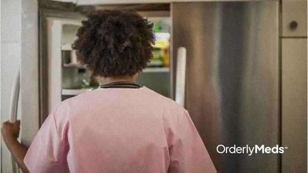 Women looking into her fridge to take out her semaglutide