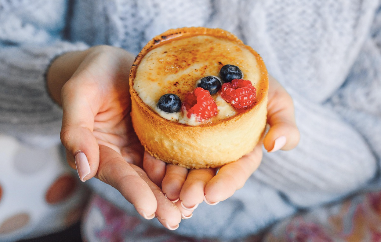 A person holding a dessert