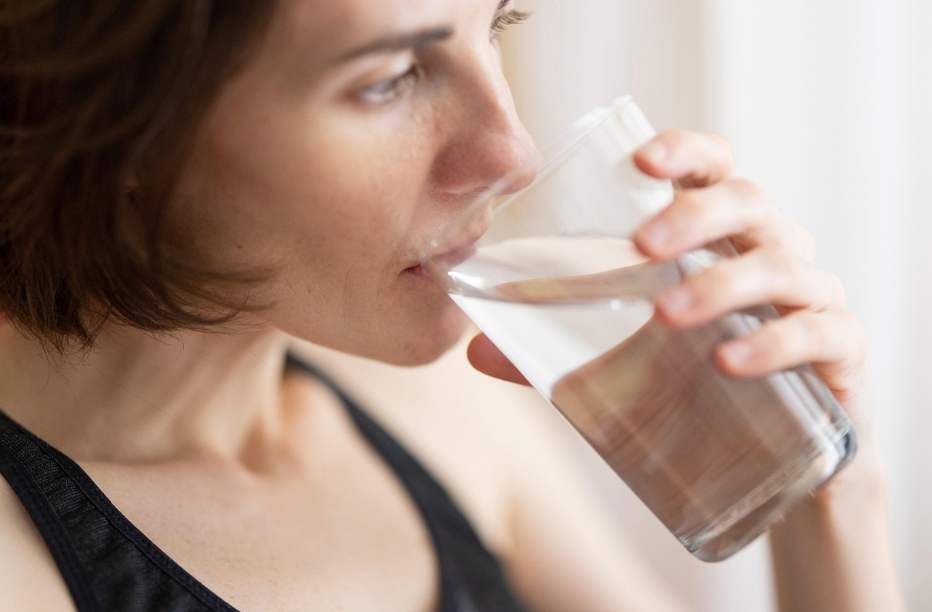 A person drinking water.