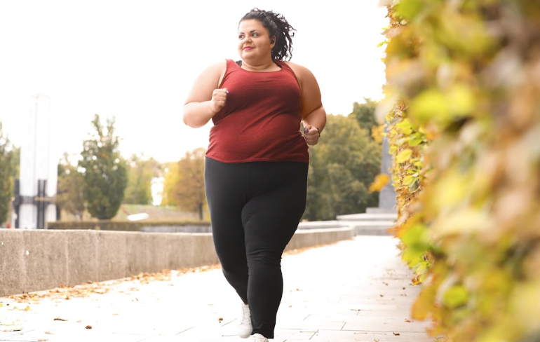 A person running down an empty street.