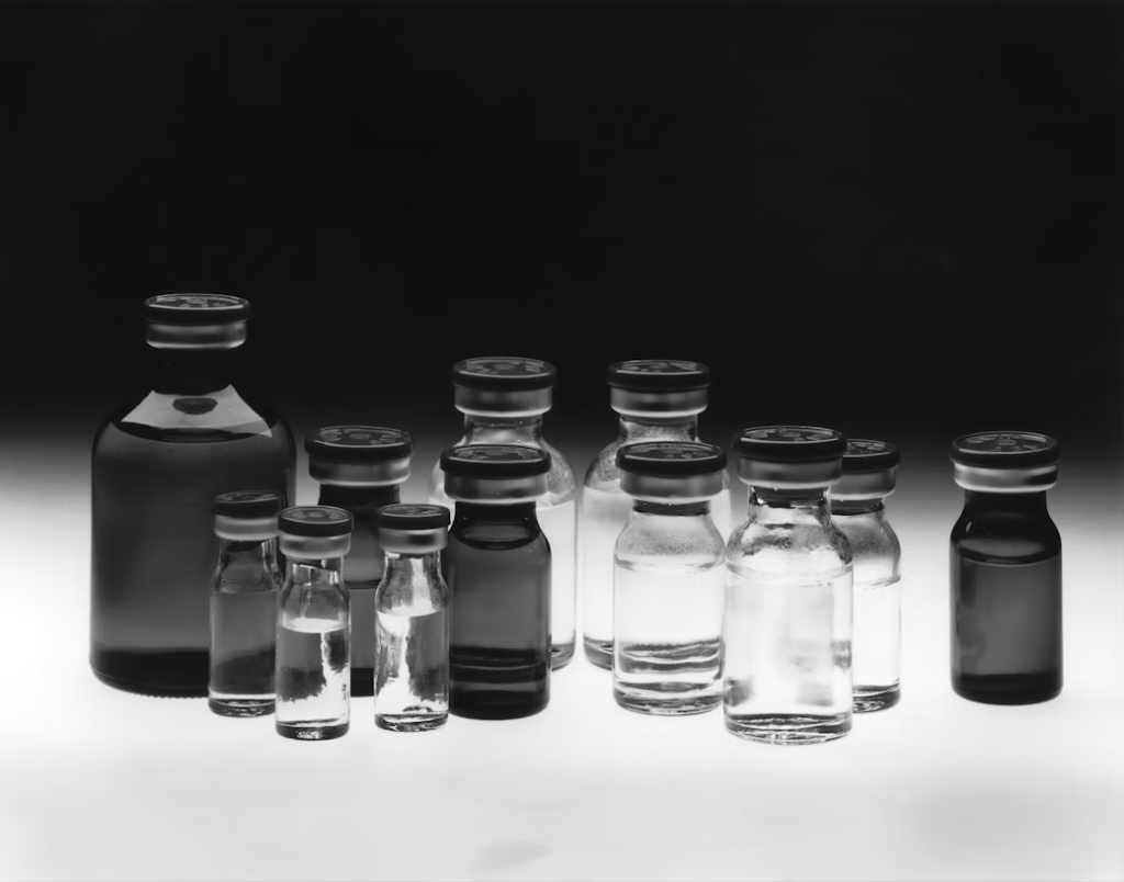 Medical vials with black caps.